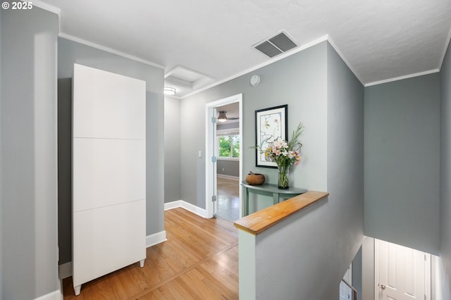 420 S State St, Lake Oswego, OR 97034 - corridor with attic access, light wood-style flooring, and crown molding