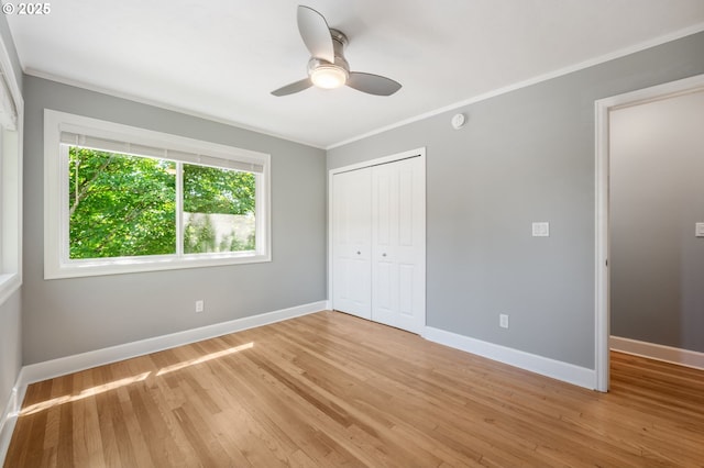 420 S State St, Lake Oswego, OR 97034 - unfurnished bedroom with a closet, light wood-style flooring, ornamental molding, and ceiling fan