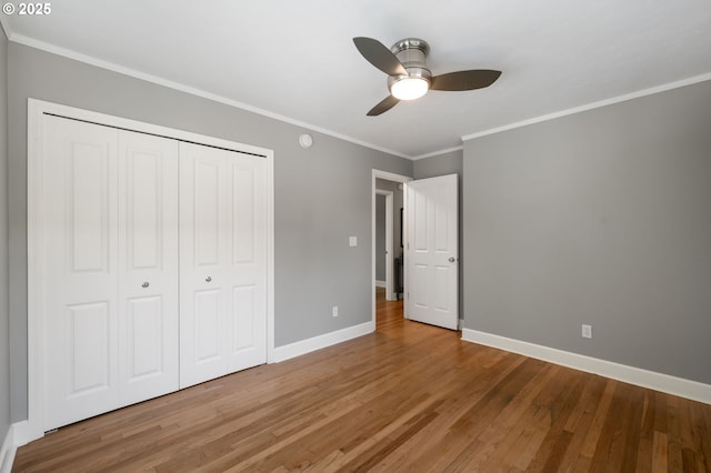 420 S State St, Lake Oswego, OR 97034 - unfurnished bedroom with wood finished floors, ornamental molding, a closet, and ceiling fan
