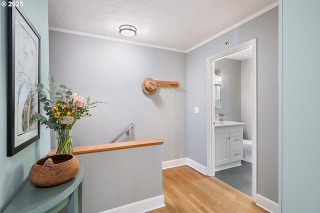 420 S State St, Lake Oswego, OR 97034 - corridor featuring an upstairs landing, wood finished floors, and ornamental molding