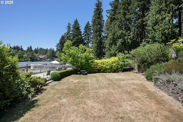 420 S State St, Lake Oswego, OR 97034 - view of green lawn featuring a dock and a forest view
