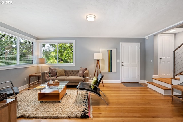 420 S State St, Lake Oswego, OR 97034 - living room with stairway, wood finished floors, and ornamental molding