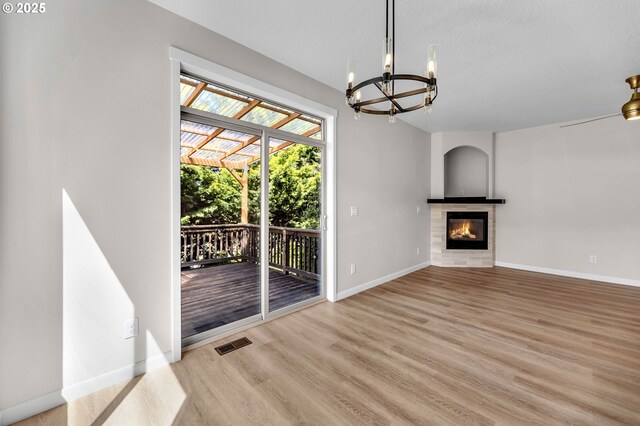 3707 NE Minnehaha St, Vancouver, WA 98661 - unfurnished living room featuring baseboards, visible vents, light wood finished floors, a notable chandelier, and a tile fireplace