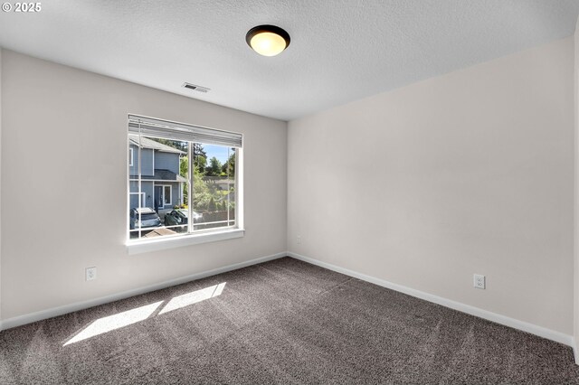3707 NE Minnehaha St, Vancouver, WA 98661 - empty room featuring a textured ceiling, visible vents, baseboards, and carpet floors