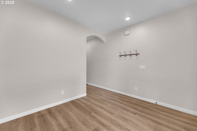 3707 NE Minnehaha St, Vancouver, WA 98661 - unfurnished room featuring light wood finished floors, baseboards, arched walkways, and recessed lighting
