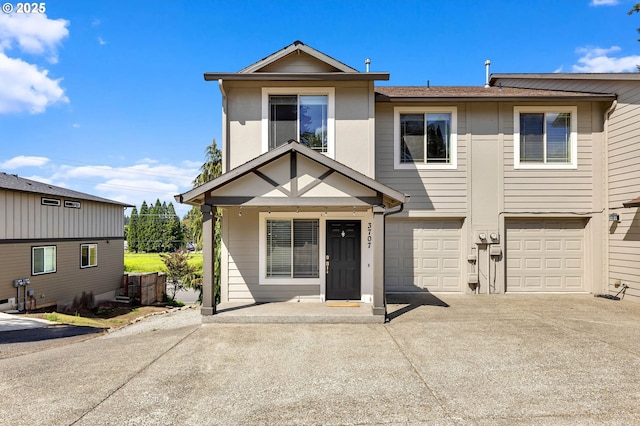 3707 NE Minnehaha St, Vancouver, WA 98661 - view of property with concrete driveway and an attached garage