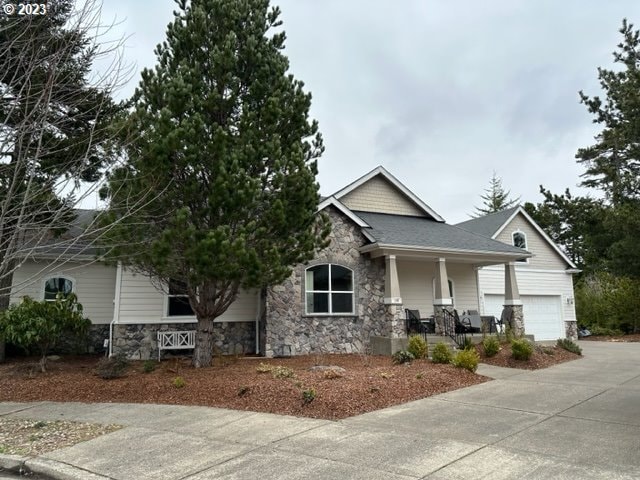 view of front of property with a porch and a garage