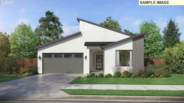 view of front of home featuring a garage and a front lawn