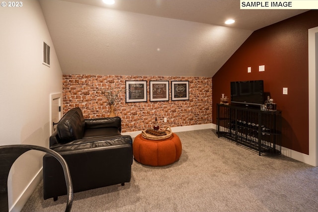 interior space featuring carpet and vaulted ceiling