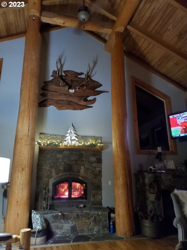 interior space with hardwood / wood-style floors, wood ceiling, a fireplace, and beamed ceiling