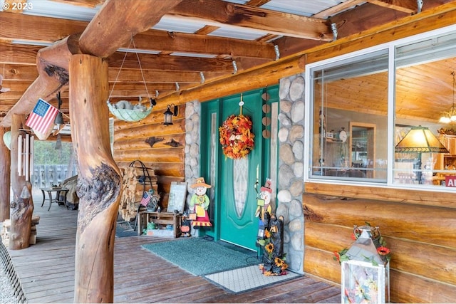 doorway to property featuring a wooden deck