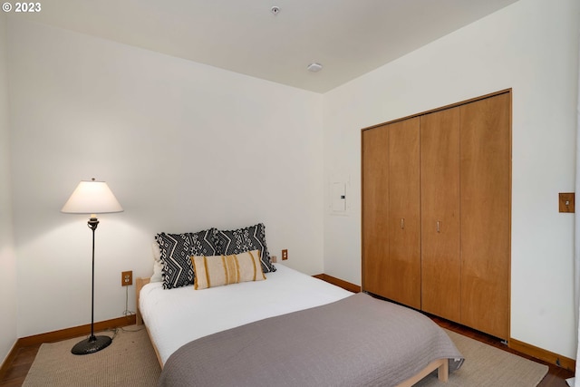 bedroom featuring a closet and wood-type flooring