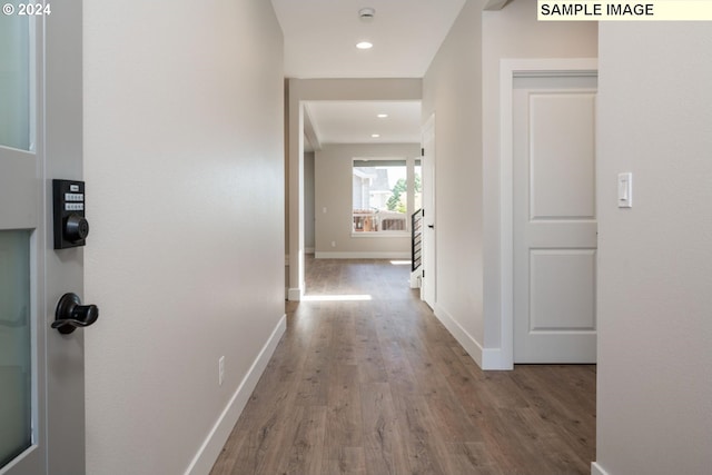 12445 SW Trask St, Beaverton, OR 97007 - corridor featuring baseboards, wood finished floors, and recessed lighting