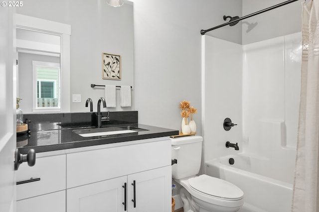 full bathroom with vanity, toilet, and shower / tub combo