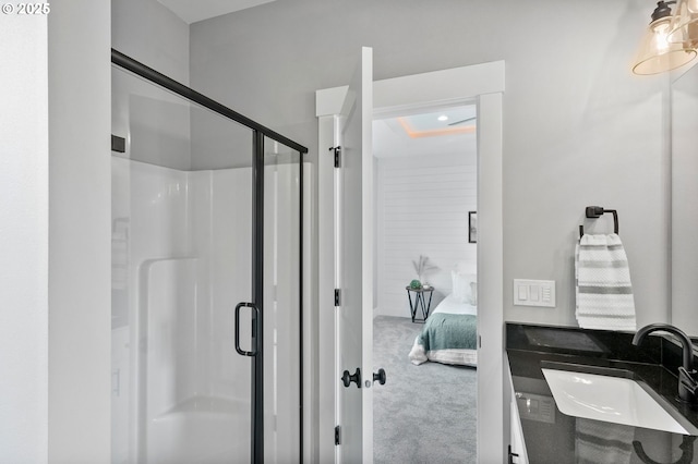 bathroom with sink and an enclosed shower