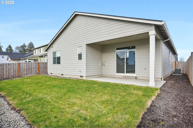 rear view of property featuring a yard and a patio