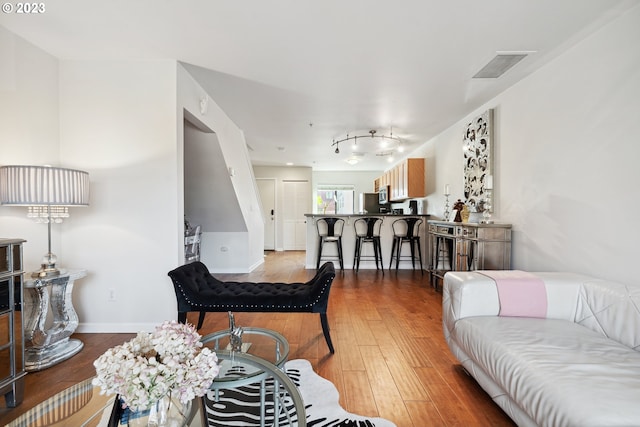 living room featuring dark hardwood / wood-style flooring