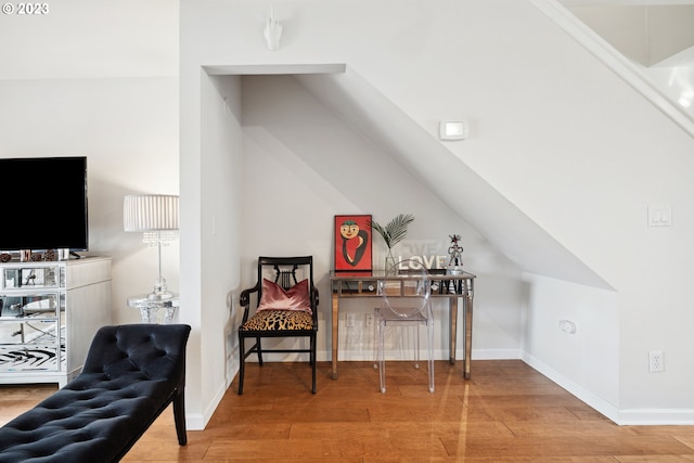 bonus room with light hardwood / wood-style floors and vaulted ceiling