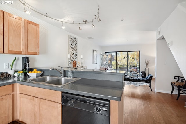 kitchen featuring light brown cabinetry, hardwood / wood-style floors, sink, dishwasher, and track lighting