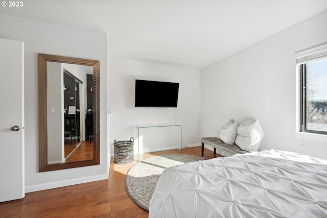 bedroom with wood-type flooring