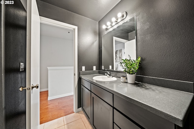 bathroom featuring large vanity and tile floors