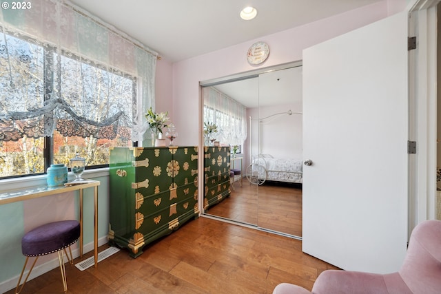 sitting room with hardwood / wood-style floors