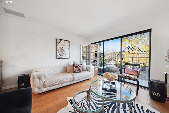 living room with light hardwood / wood-style flooring