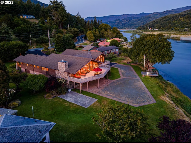 bird's eye view with a water and mountain view