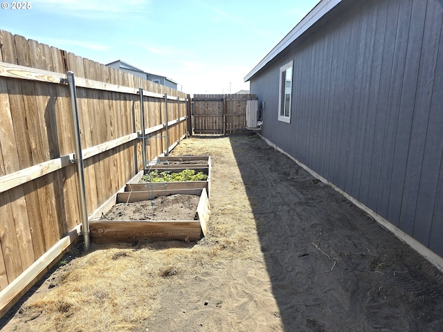 731 NE 11th St, Hermiston, OR 97838 - fenced backyard featuring a vegetable garden