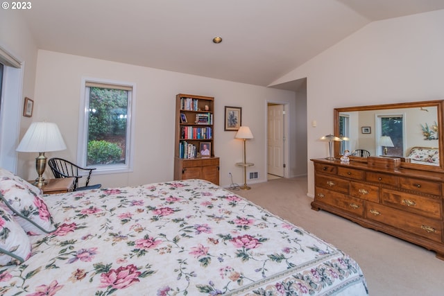 carpeted bedroom featuring lofted ceiling