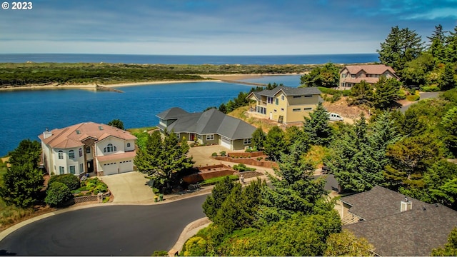 birds eye view of property with a water view