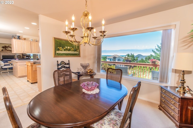 dining room with a notable chandelier and light tile flooring