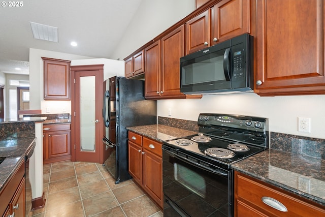 kitchen featuring black appliances, vaulted ceiling, dark stone countertops, brown cabinetry, and recessed lighting