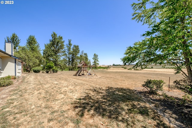 view of yard featuring a playground