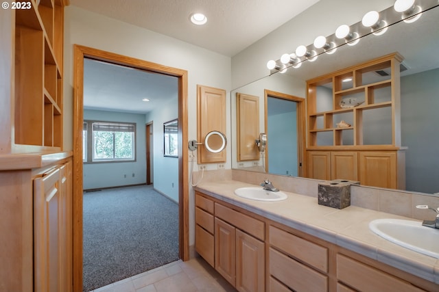 bathroom featuring double sink vanity and tile flooring