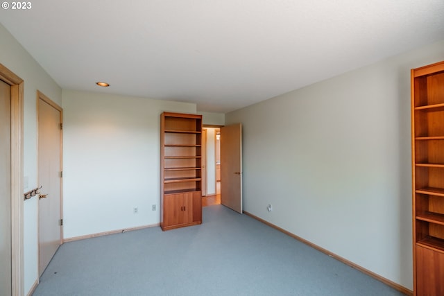 unfurnished room with carpet flooring