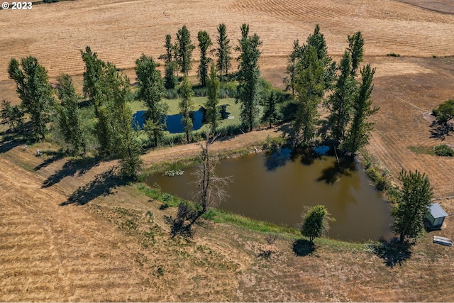 drone / aerial view with a rural view and a water view