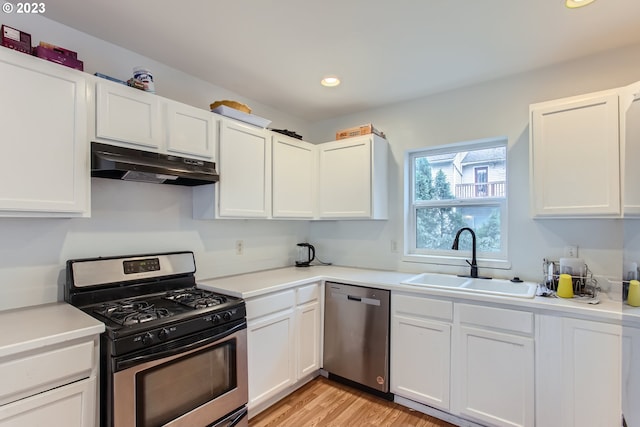 kitchen with white cabinets, sink, and appliances with stainless steel finishes