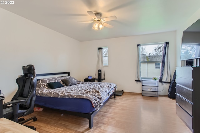 bedroom featuring light wood-type flooring and ceiling fan