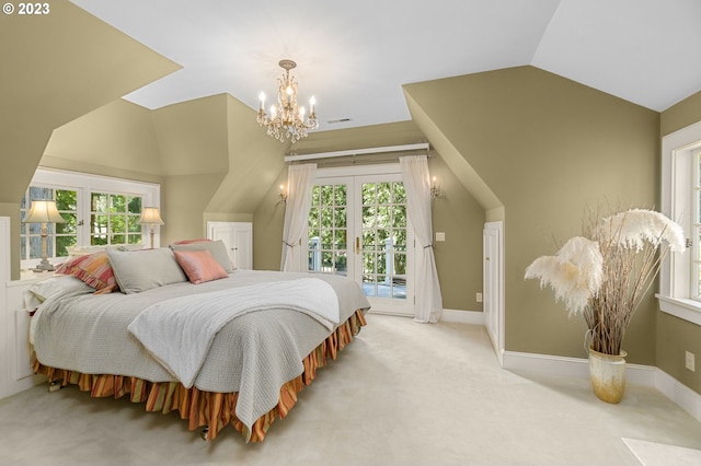 bedroom with access to outside, french doors, a chandelier, and multiple windows