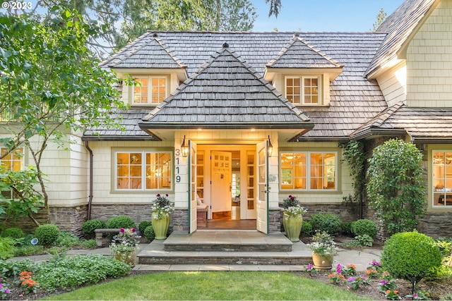 view of exterior entry with covered porch