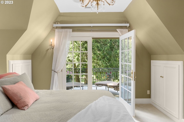 bedroom featuring light carpet, lofted ceiling, and an inviting chandelier