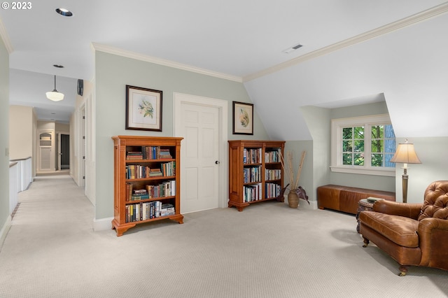 living area with lofted ceiling, ornamental molding, and light carpet