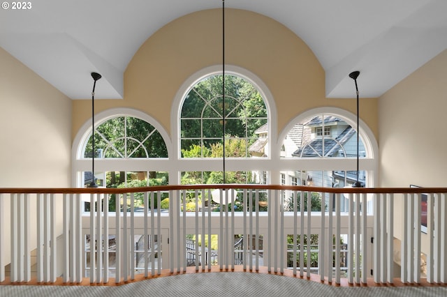 hallway featuring vaulted ceiling