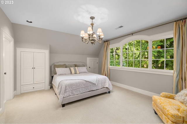 carpeted bedroom featuring lofted ceiling and a notable chandelier