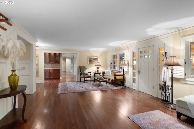 interior space with crown molding and dark wood-type flooring