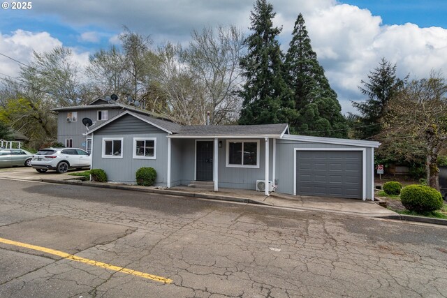 view of front of property featuring a garage and a porch