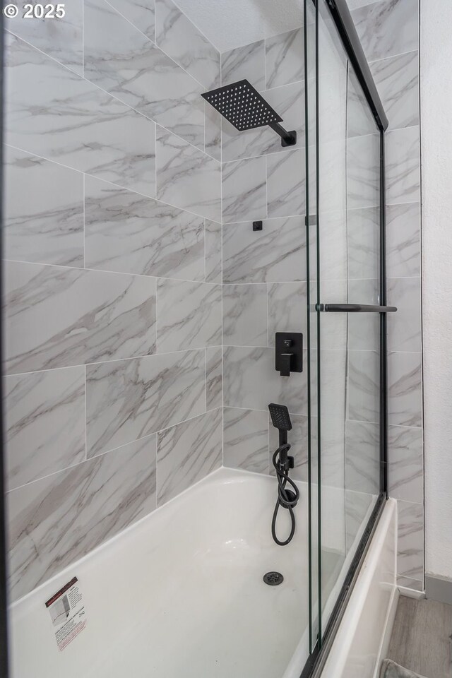 full bath featuring enclosed tub / shower combo