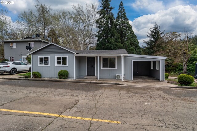 view of front of home featuring an attached carport
