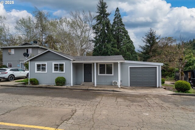 view of front of property featuring an attached garage and driveway